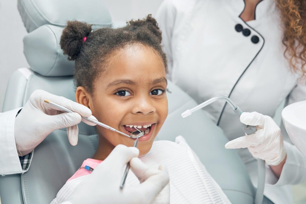 happy afro kid regular check up teeth dental clinic 1 scaled.jpg